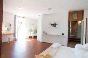A bed or beds in a room at Seafront Villa Aggeliki