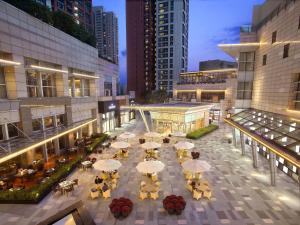 an overhead view of a courtyard with tables and chairs at Grand Hyatt Shenzhen in Shenzhen