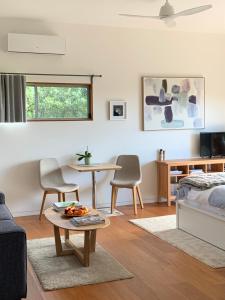 A seating area at Callemondah Studio with stunning views, in Bangalow and Byron Hinterland