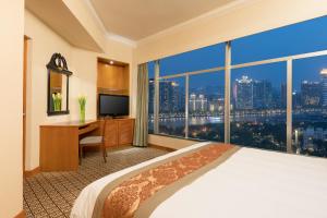 
a hotel room with a view of the ocean at Ramada by Wyndham Pearl Guangzhou in Guangzhou
