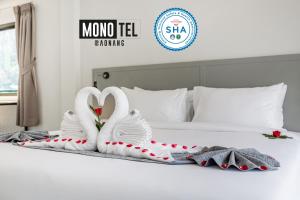 Postel nebo postele na pokoji v ubytování Monotel Aonang