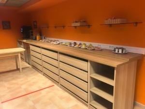 a kitchen with a long counter with food on it at Hotel Maruja Nozana in Viella