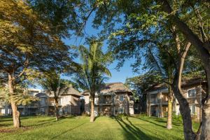 an exterior view of a house with trees at Veranda Tamarin Hotel & Spa in Tamarin