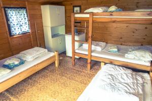 Postel nebo postele na pokoji v ubytování Chatky-Bítov 399 + 21 fotografií