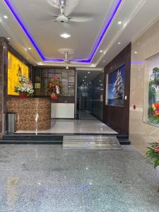 a lobby with purple lighting in a building at MV Hotel in Hai Phong