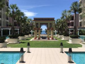 a gazebo at a resort with a pool at marrakesh มาราเกซ หัวหิน in Hua Hin