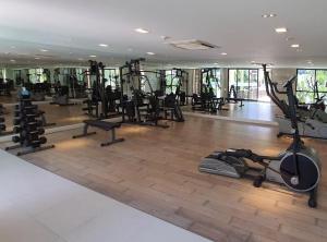a gym with treadmills and exercise equipment on the floor at marrakesh มาราเกซ หัวหิน in Hua Hin