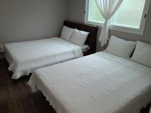 Ein Bett oder Betten in einem Zimmer der Unterkunft Santafe