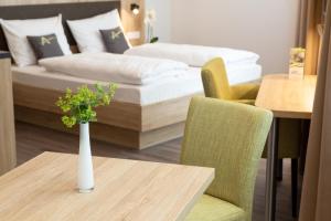 Postel nebo postele na pokoji v ubytování Aparthotel Am Pfaffenstein