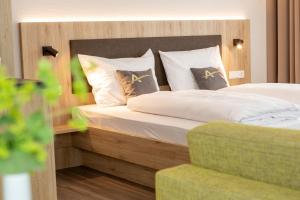 Postel nebo postele na pokoji v ubytování Aparthotel Am Pfaffenstein