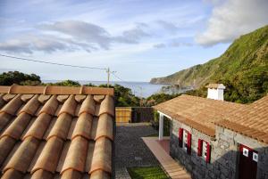 a view of the ocean from the roof of a house at Casas Da Faja in Praia do Norte