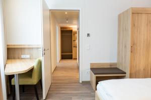 Postel nebo postele na pokoji v ubytování Aparthotel Am Pfaffenstein