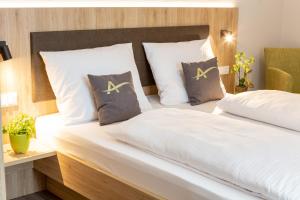 Postel nebo postele na pokoji v ubytování Aparthotel Am Pfaffenstein