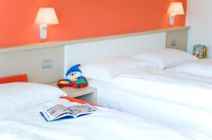 Voodi või voodid majutusasutuse Garda Sporting Club Hotel toas
