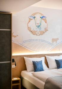 Krevet ili kreveti u jedinici u okviru objekta JUFA Hotel Weiz