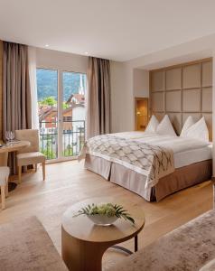 Postel nebo postele na pokoji v ubytování Hotel Alte Post Bonaduz