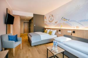 Säng eller sängar i ett rum på JUFA Hotel Weiz