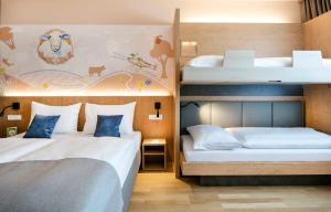 Krevet ili kreveti u jedinici u okviru objekta JUFA Hotel Weiz