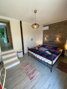 a bedroom with a bed in a room with a staircase at Apartments Apartim Piran in Piran