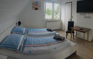 Postel nebo postele na pokoji v ubytování Pension An der Reling