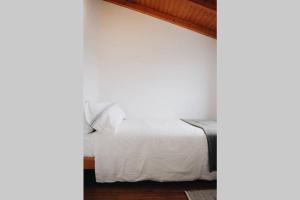 Cama ou camas em um quarto em Casa 61