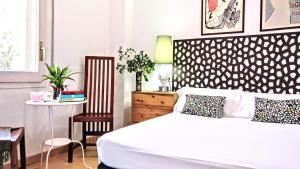 Ein Bett oder Betten in einem Zimmer der Unterkunft BizFlats Garden House