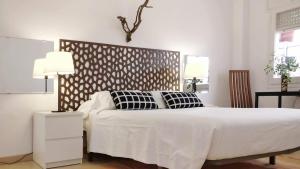 Ein Bett oder Betten in einem Zimmer der Unterkunft BizFlats Garden House