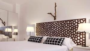 Ein Bett oder Betten in einem Zimmer der Unterkunft BizFlats Garden House