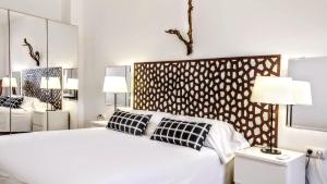 Ein Bett oder Betten in einem Zimmer der Unterkunft BizFlats Garden House