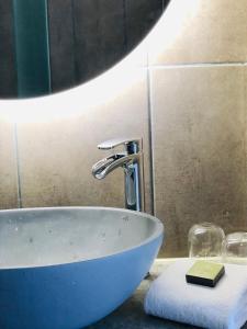 a bathroom sink with a faucet on a counter at Hotell Persnäs in Persnäs