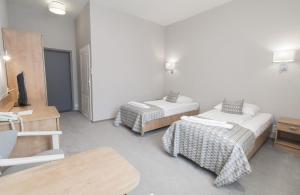 Postel nebo postele na pokoji v ubytování Hotel Jan Sander