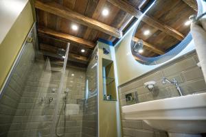 a bathroom with a sink and a shower at VILA OPT in Constanţa