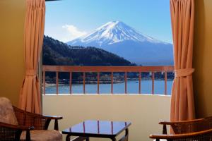 
a view from the balcony of a cabin overlooking a lake at Hotel New Century in Fujikawaguchiko
