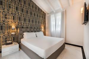 Postel nebo postele na pokoji v ubytování Hotel Stella Della Versilia