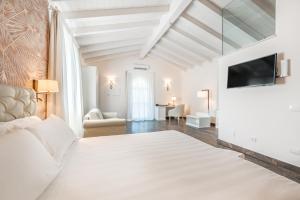 Postel nebo postele na pokoji v ubytování Hotel Stella Della Versilia