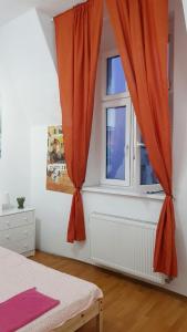 a bedroom with a window and a bed at Private Cool Rooms Plebiscytowa in Katowice