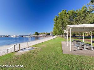 a park with benches and a pavilion next to the beach at Bushmans, 9 24 Tomaree Street - Spacious townhouse with air conditioning and close to Nelson Bay Town Centre in Nelson Bay