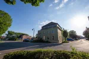 a small building on the side of a street at Green & Breakfast Chambre Satita in Niederpallen