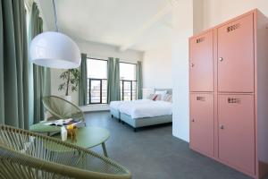 Letto o letti in una camera di Pink Flamingo Boutique Hostel