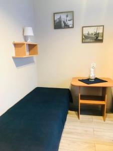 Posteľ alebo postele v izbe v ubytovaní Karwia Pokoje & Apartamenty