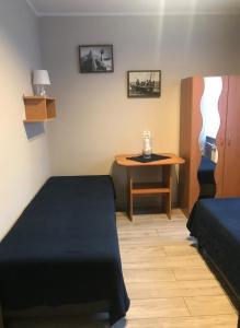 Posteľ alebo postele v izbe v ubytovaní Karwia Pokoje & Apartamenty