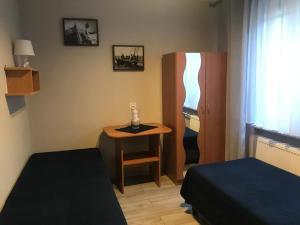 Posteľ alebo postele v izbe v ubytovaní Karwia Pokoje & Apartamenty