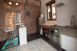Kuchyň nebo kuchyňský kout v ubytování Apartamento de lujo en Gijòn