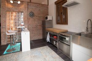 Kuchyň nebo kuchyňský kout v ubytování Apartamento de lujo en Gijòn
