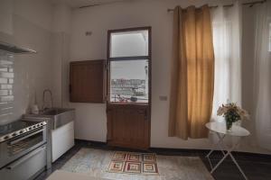 Kuchyň nebo kuchyňský kout v ubytování Apartamento de lujo en Gijòn