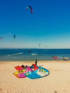 a group of people flying kites on the beach at Апартаменти Бриз 1 in Pomorie