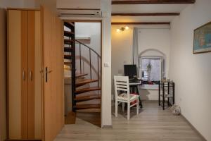 Televízia a/alebo spoločenská miestnosť v ubytovaní Apartment Martin