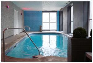 a large swimming pool in a building with at Bluewaters Hotel Blackpool in Blackpool