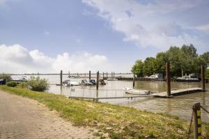 a body of water with boats in it at Fährhaus Kollmar in Kollmar