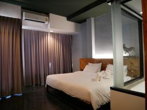Postel nebo postele na pokoji v ubytování OU HOTEL